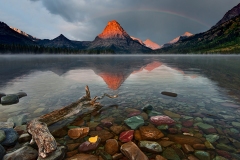 "Morning Beacon"   Sinopah mountain emerging from a sunrise storm reflected by 2 Medicine Lake at Glacier National Park.