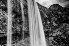 "Perspective" My effort to create a unique image of popular Seljalandsfoss.  Selajalandsfoss is a huge waterfall set in a huge naturally photogenic amphitheater in southern Iceland.