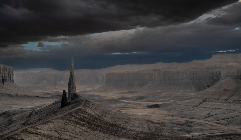 Time lapse tracking shot of Long Dong Silver spire rock over mud